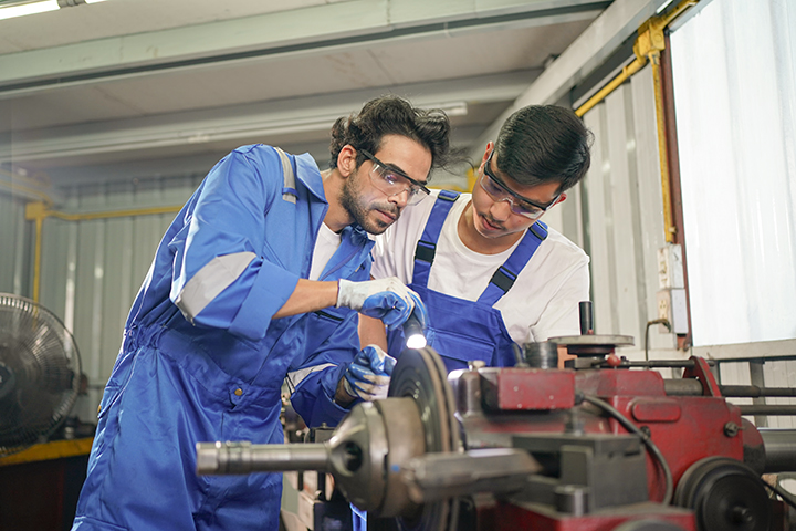 Workers changing and repair part of wheels at the car service